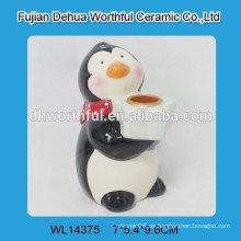 Cutely cerámica pingüino vela titular